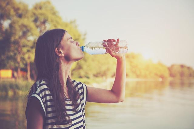 Woman drinking a water bottle